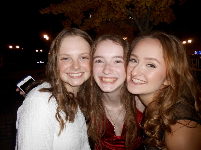 Photo of the author with friends after Fall Formal