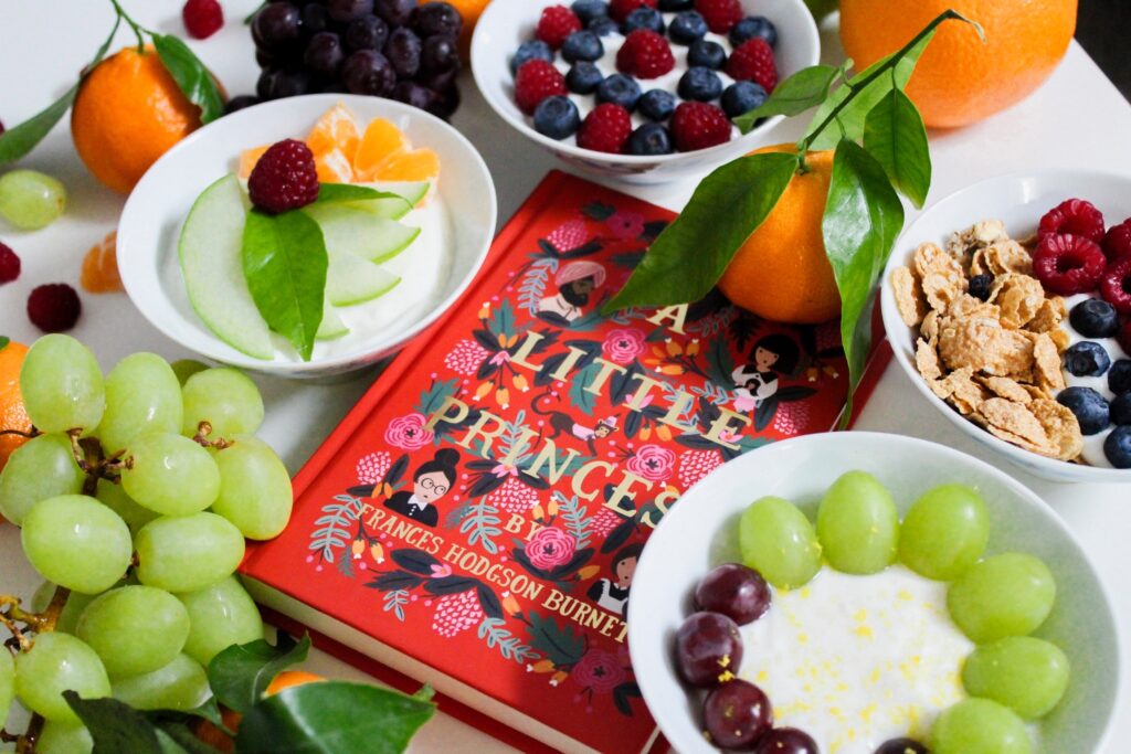 Photo of a book surrounded by fruit