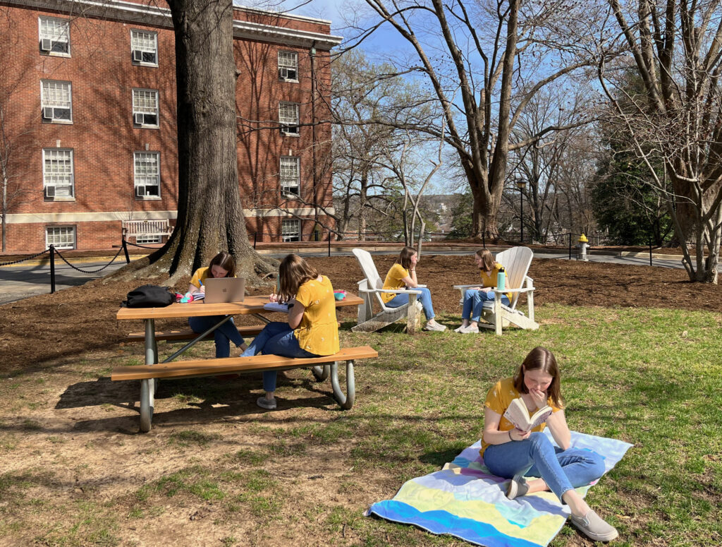 A photo with six different versions of the author studying, reading, and talking.